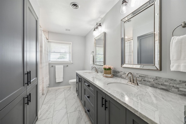 full bath with visible vents, marble finish floor, toilet, and a sink