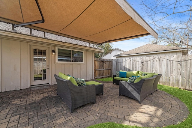 view of patio / terrace featuring an outdoor hangout area and a fenced backyard