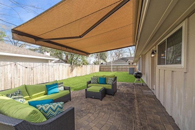 view of patio featuring central AC, outdoor lounge area, and a fenced backyard