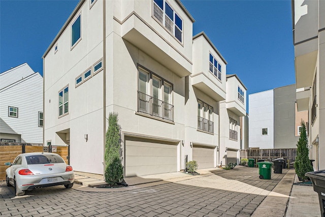 exterior space featuring a garage and stucco siding