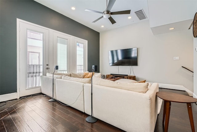 living area with dark wood-style floors, visible vents, recessed lighting, and a ceiling fan