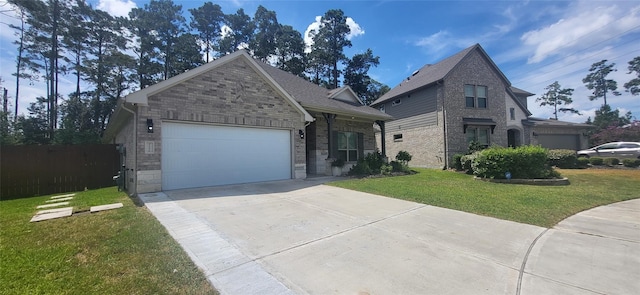 view of front of house with brick siding, a front lawn, fence, a garage, and driveway