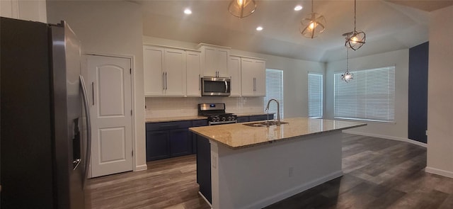 kitchen featuring a sink, tasteful backsplash, appliances with stainless steel finishes, and dark wood-style floors