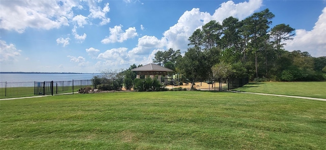 surrounding community featuring a gazebo, a yard, and fence