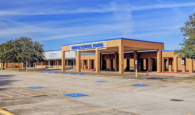 view of property featuring uncovered parking