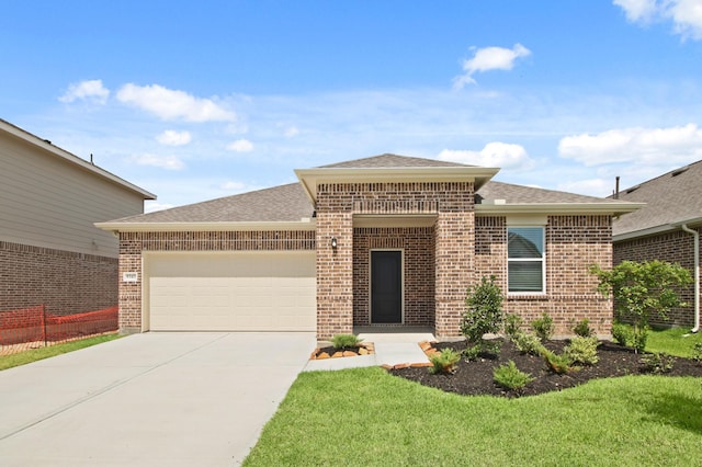 8343 Bay Oaks Dr, Baytown, TX 77523 - view of front of property featuring brick siding, a garage, driveway, a shingled roof, and a front lawn