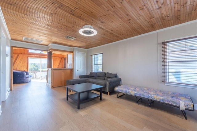 living room with wooden ceiling, crown molding, light wood-style floors, and visible vents