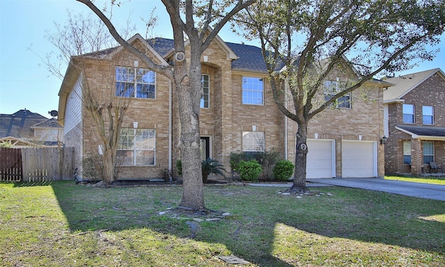 traditional-style house featuring a garage, brick siding, a front lawn, and fence