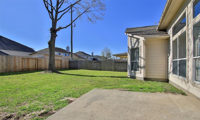 view of yard with a fenced backyard and a patio area