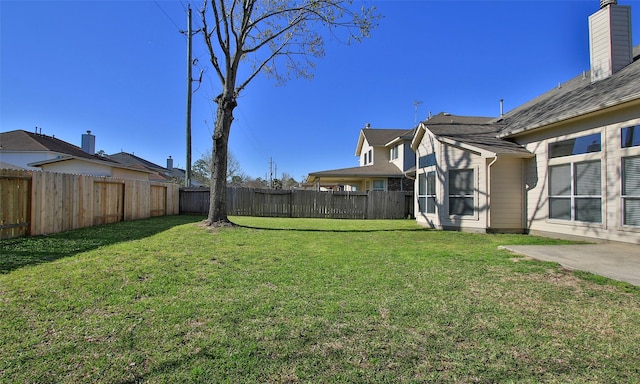 view of yard featuring a fenced backyard