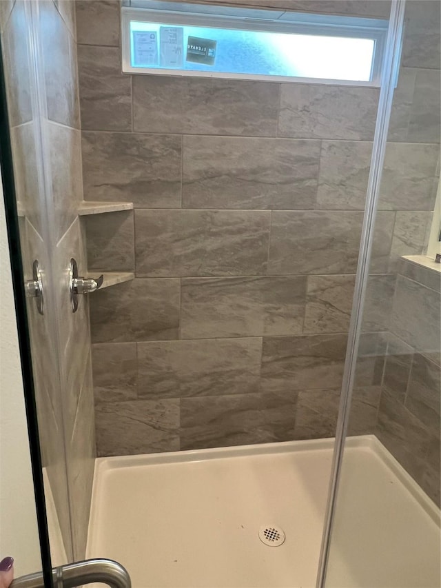 full bathroom featuring a stall shower