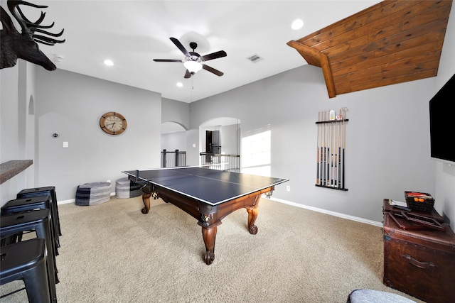 recreation room featuring visible vents, ceiling fan, baseboards, carpet floors, and arched walkways