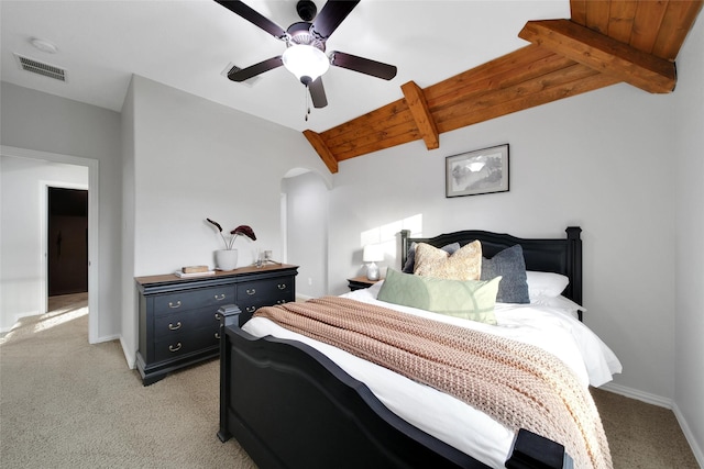 bedroom featuring lofted ceiling with beams, visible vents, light carpet, and wooden ceiling