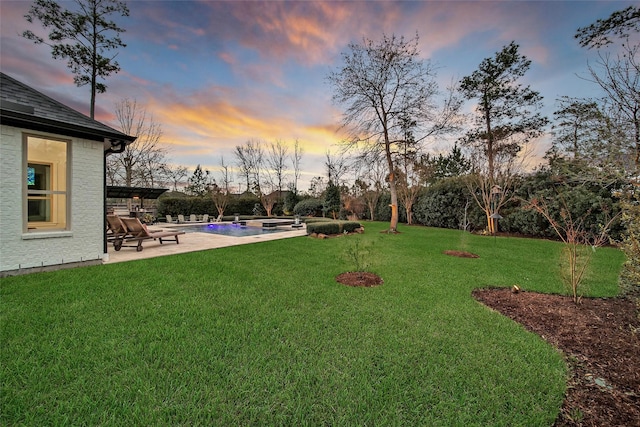 view of yard with a patio area and an outdoor pool