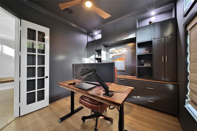 office area with crown molding, a ceiling fan, baseboards, and light wood finished floors