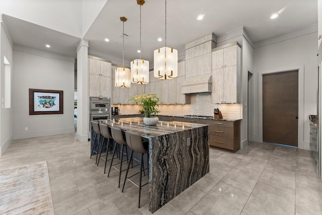 kitchen featuring dark stone countertops, a breakfast bar, custom exhaust hood, appliances with stainless steel finishes, and modern cabinets