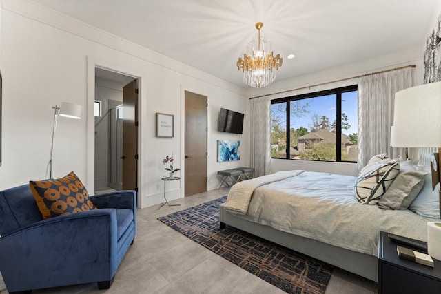 bedroom with an inviting chandelier, light tile patterned flooring, and crown molding