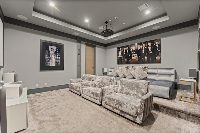 carpeted home theater room featuring visible vents, recessed lighting, a raised ceiling, and baseboards