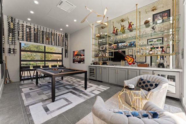 interior space featuring recessed lighting, visible vents, wet bar, and beverage cooler