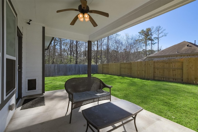 view of patio / terrace with a fenced backyard and ceiling fan