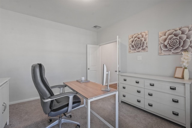 office area with baseboards, light carpet, and visible vents