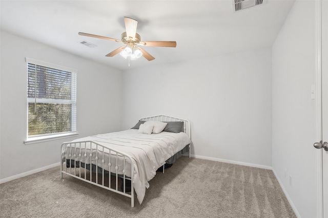 bedroom with visible vents, carpet flooring, and baseboards