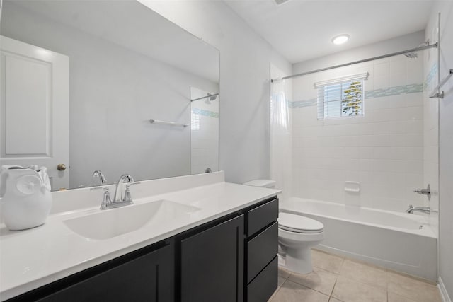 bathroom featuring vanity, tile patterned floors, toilet, and shower / bath combination