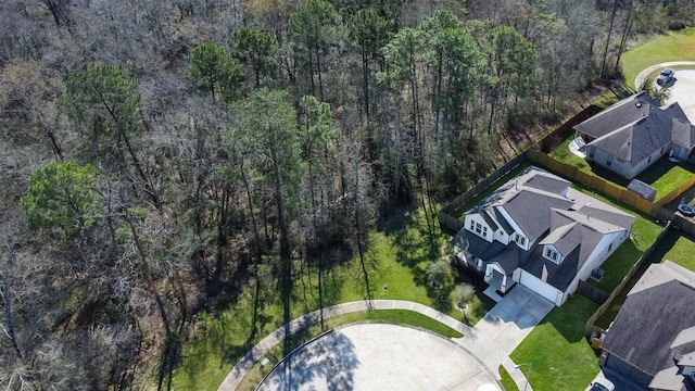 drone / aerial view featuring a view of trees