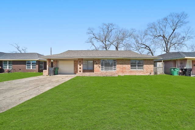 ranch-style home with brick siding, a garage, driveway, and a front yard