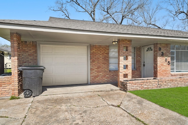 exterior space with brick siding, concrete driveway, and a shingled roof