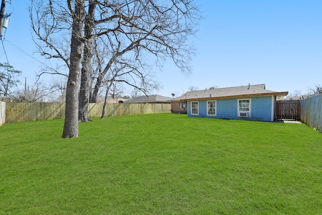 view of yard with a fenced backyard