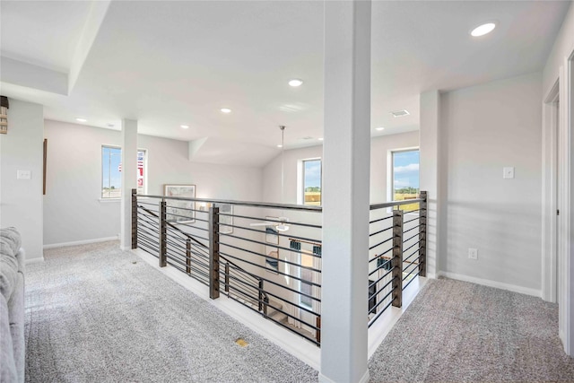 corridor with recessed lighting, baseboards, and carpet