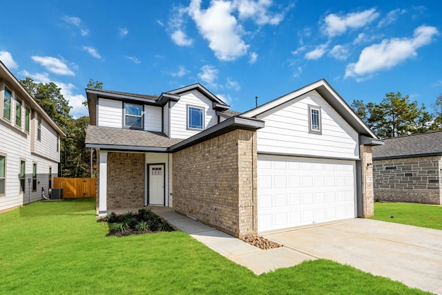 traditional-style home with brick siding, fence, central AC, a front yard, and driveway