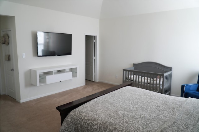 bedroom with baseboards and carpet floors