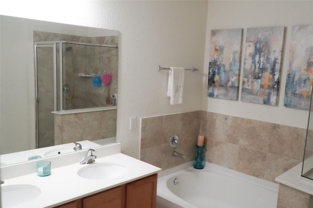 full bathroom with a bath, a stall shower, double vanity, and a sink