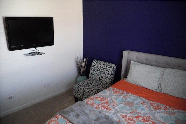 bedroom featuring baseboards and carpet floors