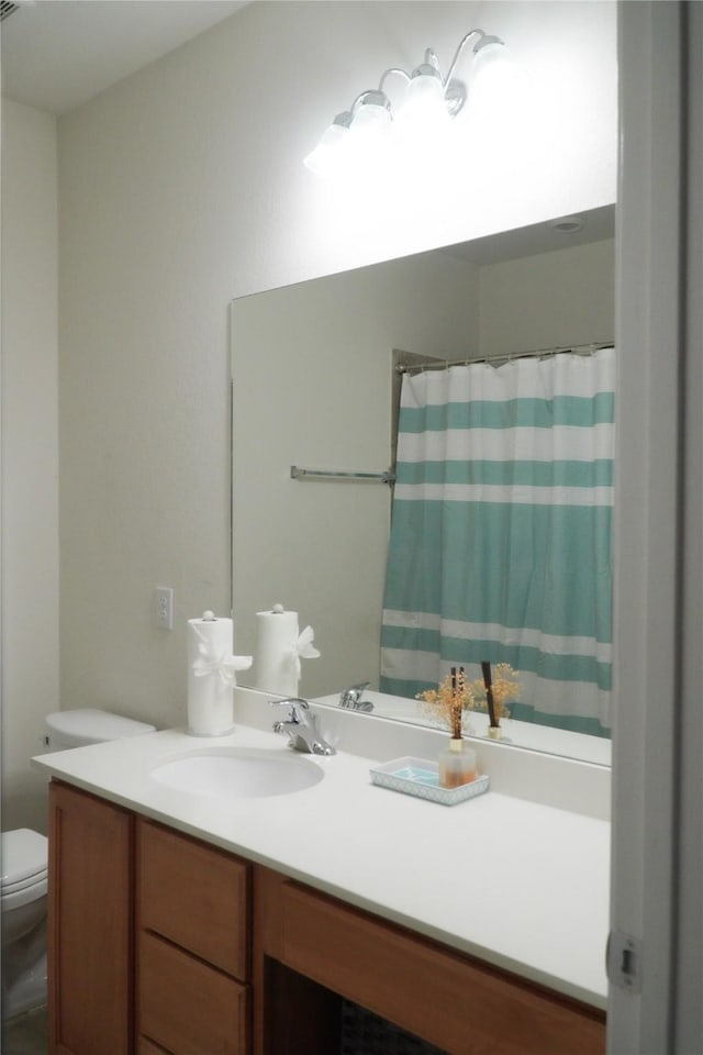 full bathroom with vanity and toilet