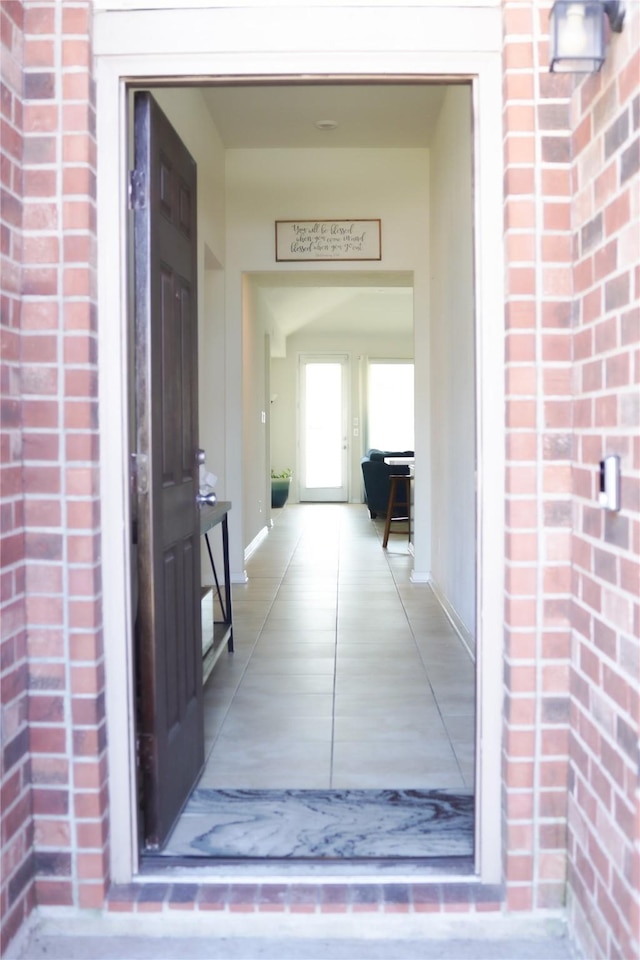 entrance to property with brick siding