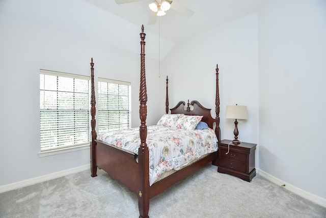 bedroom featuring carpet flooring, ceiling fan, baseboards, and lofted ceiling