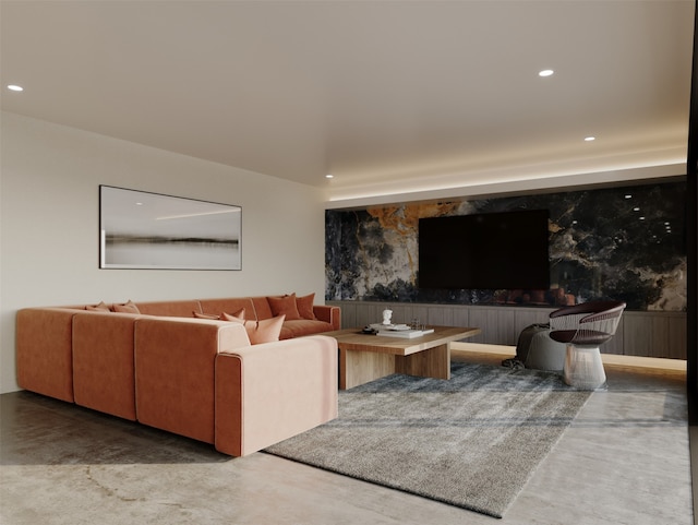 living area featuring recessed lighting and concrete floors