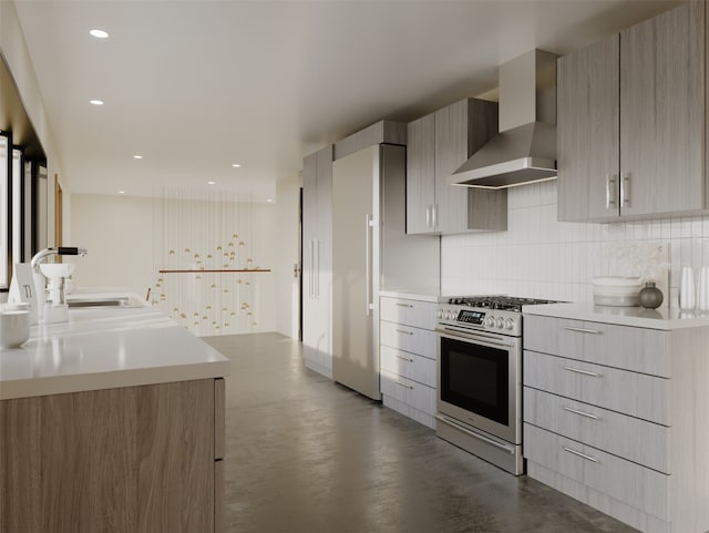 kitchen featuring decorative backsplash, light countertops, gas range, wall chimney exhaust hood, and modern cabinets