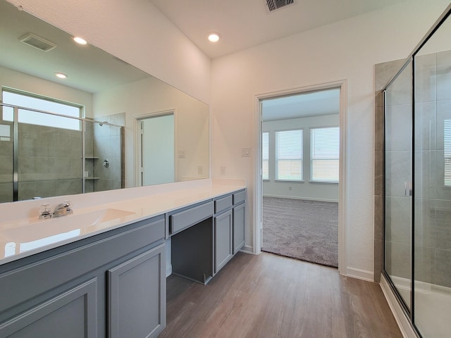 full bathroom featuring a wealth of natural light, visible vents, and a stall shower