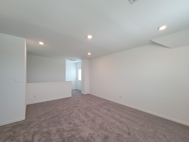 unfurnished room with recessed lighting, baseboards, and carpet floors