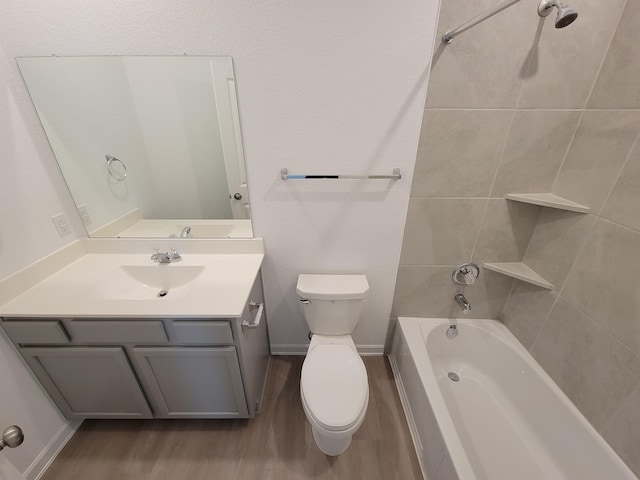 full bathroom with toilet, vanity, bathtub / shower combination, and wood finished floors