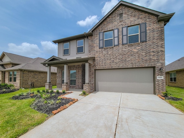 view of front of home with brick siding, a porch, concrete driveway, a front yard, and an attached garage