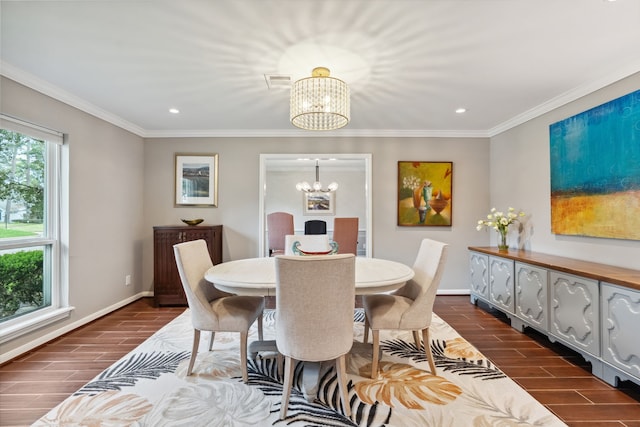 dining area featuring wood finish floors, an inviting chandelier, and ornamental molding