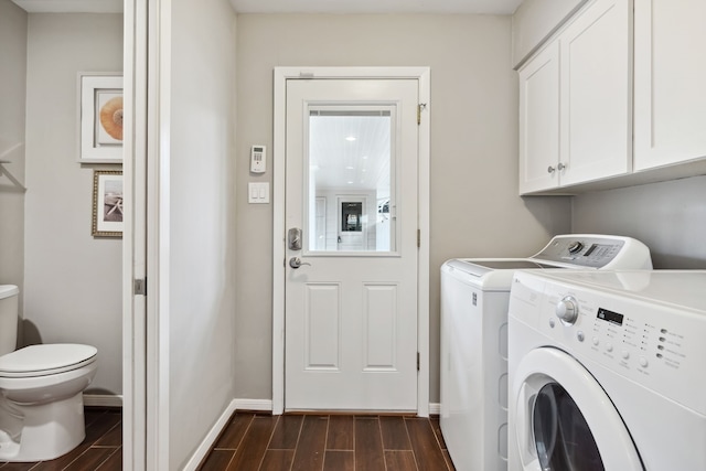 laundry room with baseboards, cabinet space, independent washer and dryer, and wood tiled floor