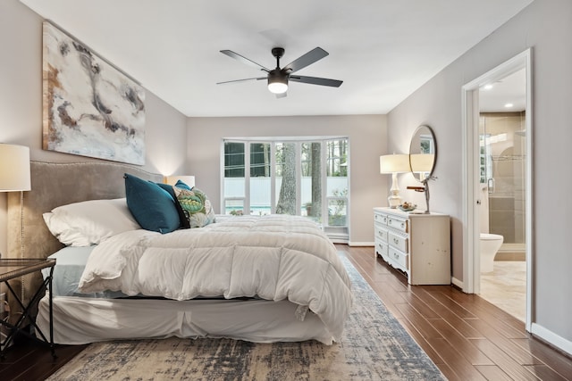 bedroom featuring wood finish floors, baseboards, a ceiling fan, and ensuite bathroom