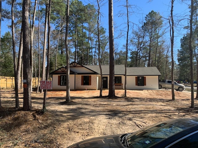 view of front of house featuring brick siding