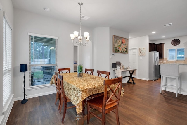 dining room featuring visible vents, baseboards, and dark wood-style flooring